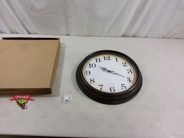 Lot 7-123484 - 16-inch vintage wall clock. Takes one AA battery.