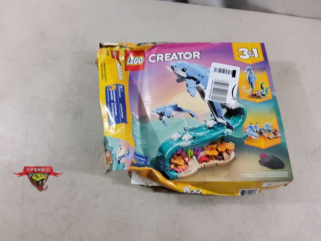 Lot 7-135679 - New - Damaged box. Bags are sealed. Lego Creator Beautiful Dolphins. #31385. 542 pcs.