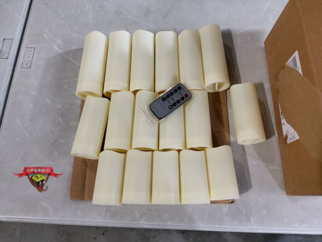 Lot 7-132986 - (17) Battery operated faux candles with remote.  Each one takes (2) AA Batteries (not included). Inc...