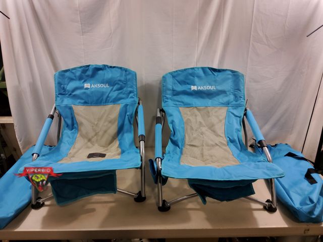 Lot 7-131282 - (2) Aksoul low beach chairs with carrying bags.