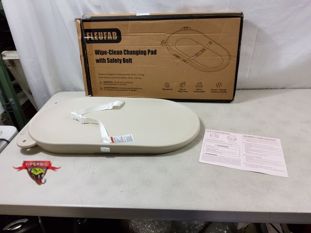 Lot 7-130662 - Fleufab wipe-clean infant changing pad with safety belt.