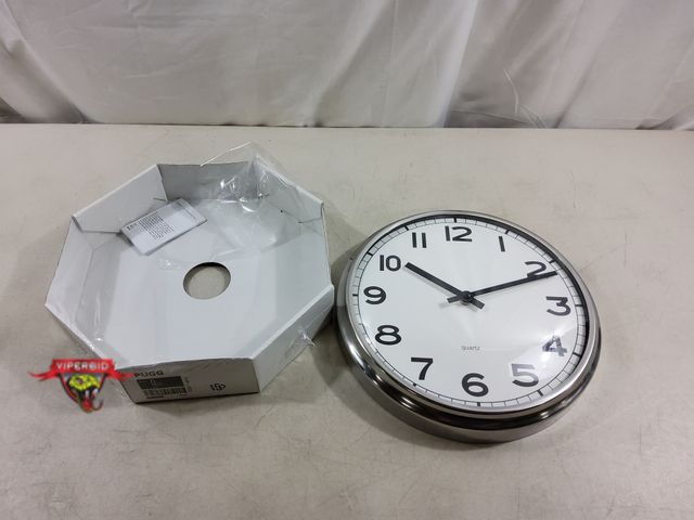 Lot 7-130148 - New! Ikea Pugg 12-1/2" Wall clock. Requires (1) "AA" Battery - not included.
