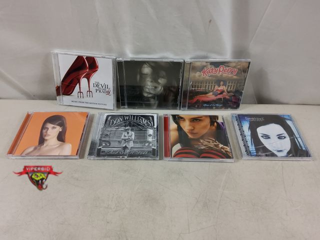 Lot 7-133548 - (7) Assorted cd's. Damaged cases. Cd's look new to like new.