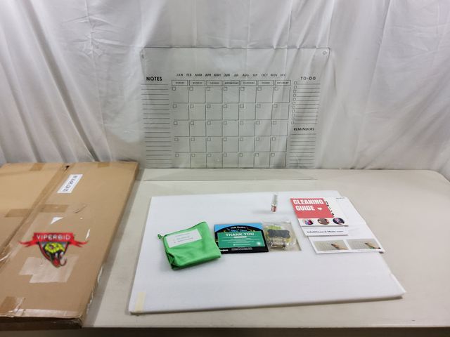 Lot 7-123313 - Crystal clear acrylic dry erase wall calendar. 28" X 20".
