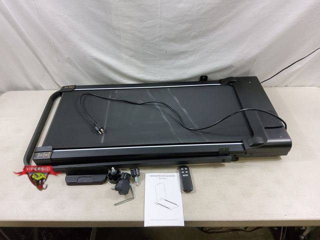 Lot 7-130370 - Walking pad with collapsible handle bar and remote. Model T007 Pro. Powers on  - belt moves.