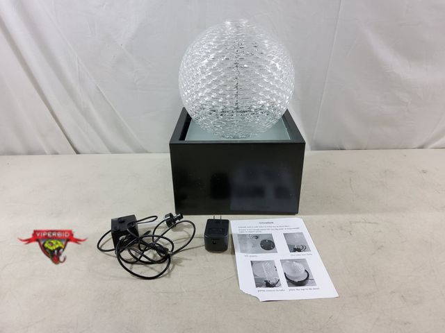 Lot 7-133770 - Tabletop Water fountain with metal base and textured glass globe. 9-1/4" X 10-1/4" X 15-1/4"H.