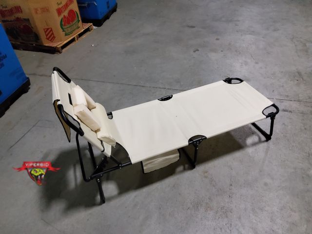 Lot 7-134934 - Used folding lounge chair with face hole. Adjustable back.