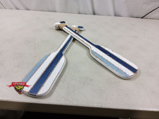 Lot 7-134679 - Crossed oars wood wall decor. 19-5/8"L X 4"W.