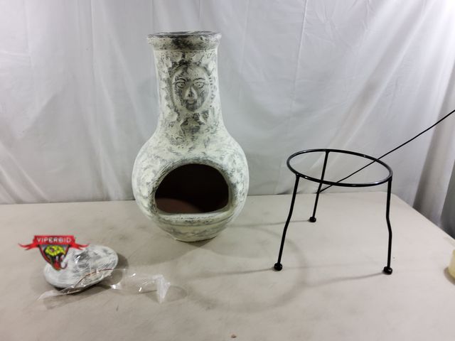 Lot 7-135796 - 32"H  Terracotta Chimenea Outdoor Fireplace with metal stand. Note: Lid - chipped / broke.