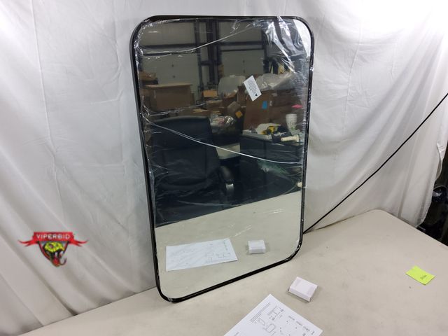 Lot 7-134404 - 24" X 36" Metal framed rounded corner mirror.