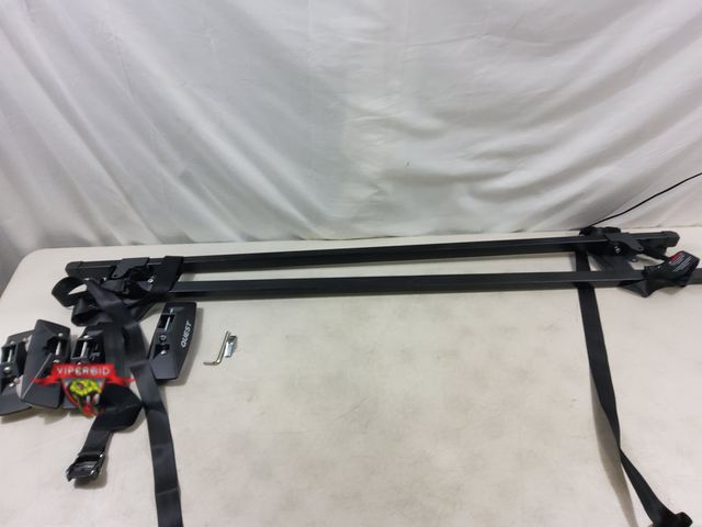 Lot 7-131799 - Quest crossbar system. Weight capaccity: 135 lb. Minimum bar spread: 254". Fits most 4 door vechicle...