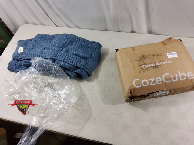 Lot 7-135612 - CozeCube dusty blue cable throw blanket. 60" X 80".