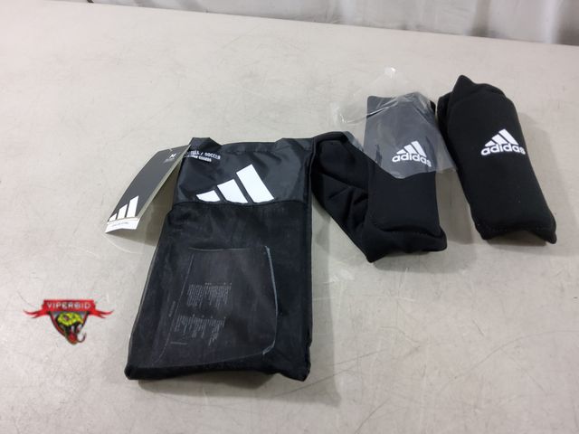 Lot 7-135727 - Adisas youth sock guards. Football/Ssoccer.Size: M.