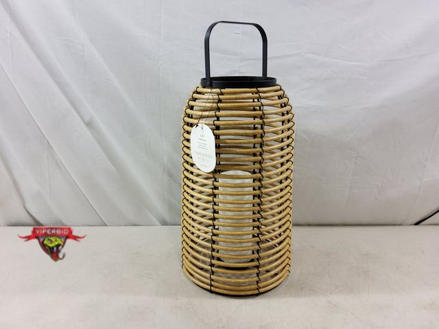 Lot 7-132445 - Battery operated resin wicker indoor / outdoor led lantern. 16"H X 9-3/4" Dia. Requires (2) "AA" Bat...
