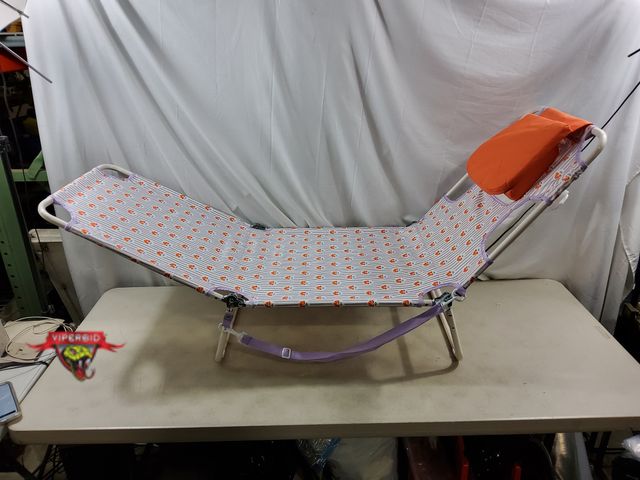 Lot 7-132447 - Folding Beach lounger with pillow.
