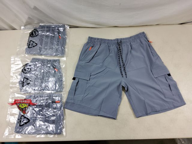 Lot 7-130509 - New! (4) Pairs of Men' s Light gray cargo shorts with 9" inseam. Size: XL.  Has (2) "Cargo" Pockets,...