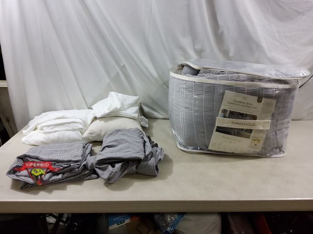 Lot 7-132845 - 12-Piece Chambray stripe king size comforter and sheet set. Includes comforter, (2) Pillowcases, (2)...