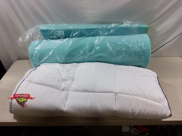 Lot 7-131691 - Twin size memory foam mattress topper with cover.