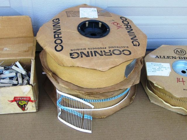 Lot 7-132768 - Two reels of resistors, 1470 and 1500 ohm.  One small box of dozens of Colber 22 ohm, 10% power resi...