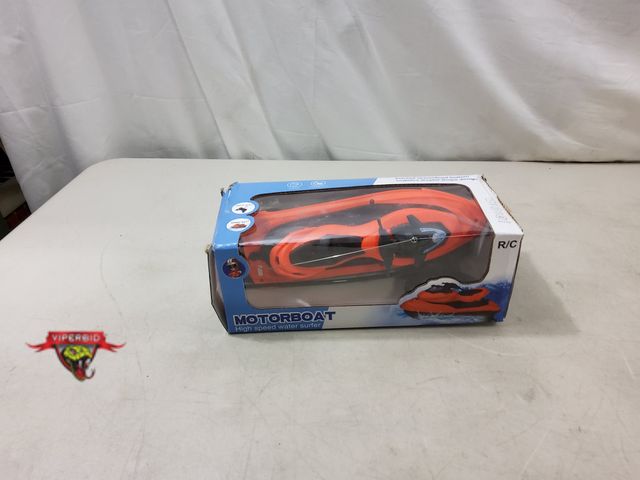 Lot 7-131451 - Remote control motorboat - high speed water surfer /jet ski. Orange/Black.  Tested - Works.