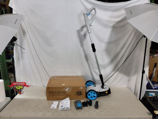 Lot 7-134293 - 9" 40V Cordless compact lawn mower. Includes battery &amp; charger. Tested to power on - blade spins...