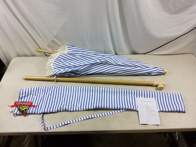 Lot 7-134894 - 6.5' Pation Umbrella with tassels.