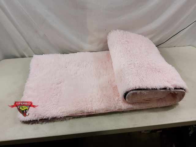 Lot 7-131751 - Pink Faux Fur area rug. 48" X 70".