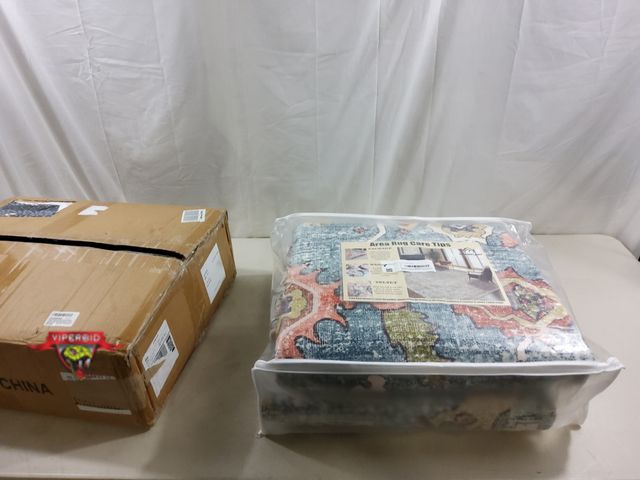 Lot 7-123316 - Champlant 9 ft. X 12 ft. Washable area rug.