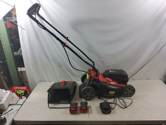 Lot 7-132915 - Cracked battery housing. Used. Ework 40V Cordless lawn mower. Includes batteries and charger. Tested...