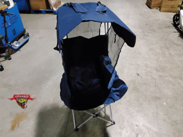 Lot 7-133294 - Folding camping chair with canopy and side mesh shade.