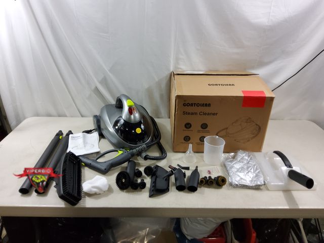 Lot 7-134086 - Goatclean steam cleaner. Model ST008. Tested to power on. Note: Plastic attachment cracked ( see pic...