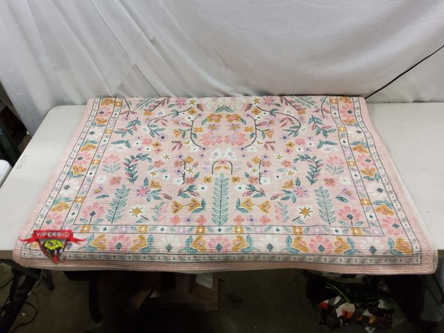 Lot 7-132577 - 4 ft. X 5 ft. 6" Floral area rug.