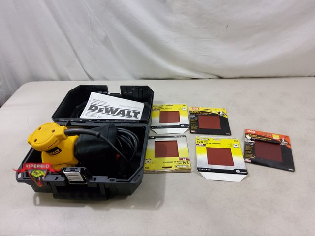 Lot 7-130465 - DeWalt DW411 Palm sander with hard case and sand paper sheets.