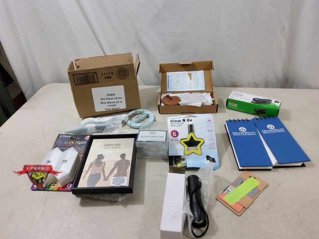 Lot 7-134658 - Lot of miscellaneous household items. Includes wind chimes, flashlight, picture frames, lights and m...