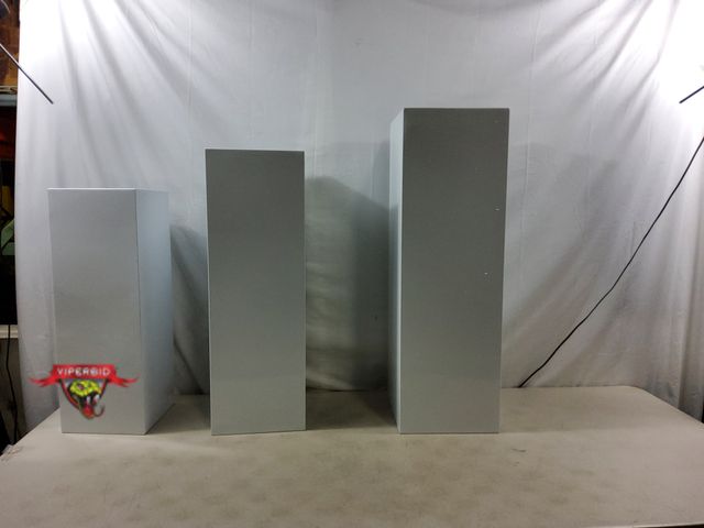 Lot 7-130840 - Set of 3 - Metal column pedastal stands. Includes 8-3/4" X 24-7/8"H, 9-1/2" X 28-7/8"H, and 32-7/8"H...