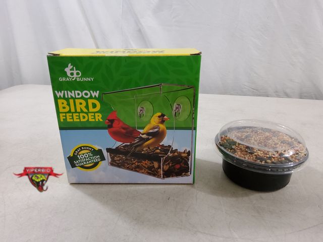 Lot 7-134659 - New! Gray Bunny window bird feeder with a container of bird seed.