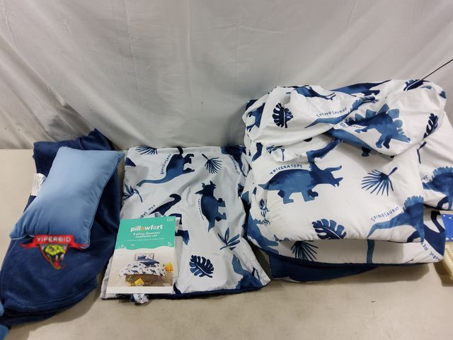 Lot 7-131526 - Pillowfort twin size 4-Piece dinosaur comforter set. Includes comforter, sham, decorative pillow, &a...