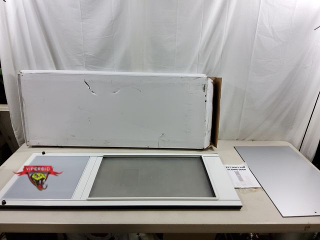 Lot 7-123639 - Pet Door for sliding door.