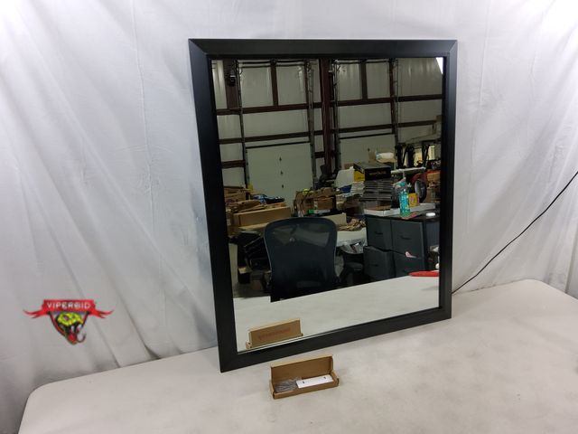 Lot 7-130350 - Retail value $109. Looks new! Briivue black metal framed mirror. 32" X 36". #D-RA8090B.