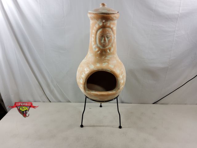 Lot 7-133957 - 32"H Terracotta Chimenea Outdoor Fireplace with metal stand. Note: Chipped lid and small crack on to...