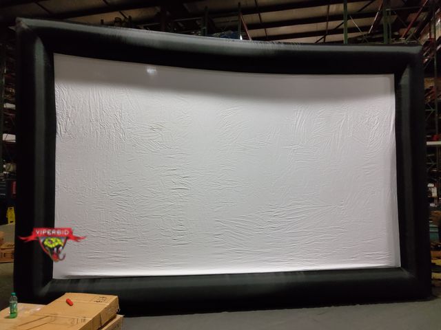 Lot 7-130354 - Outdoor movie time. Lightly used. Inflatable projection screen. No blower included. Tested. 19 ft. W...
