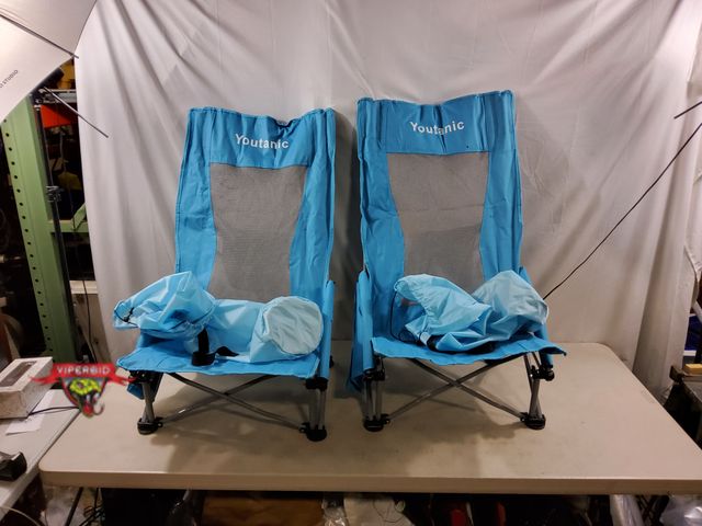 Lot 7-133178 - (2) Youtanic high back low beach chairs with side pocket and pouch on back.