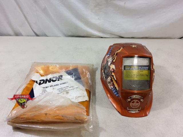 Lot 7-130094 - Miller Eleite Series welding helmet &amp; a Radnor welding screen ( 6 ft. X 8" - grommets on 12" cen...