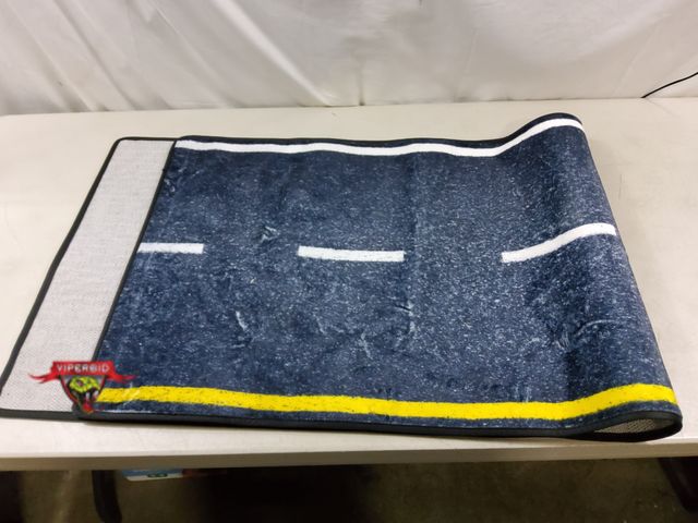 Lot 7-131468 - 24" X 70" Road area rug with non slip back.