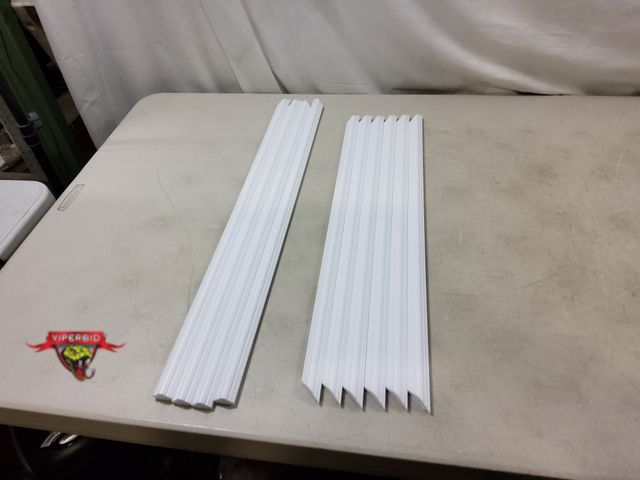 Lot 7-130037 - Lot of adhesive back plastic trim. Includes (12) Pieces of  7/8" X 26-3/4" &amp; (18) Pieces of 7/8"...