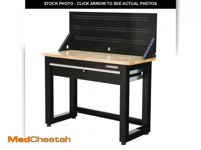 Lot 74-11826082 - Husky 48 in. W x 20 in. D 1-Drawer Black Workbench with Pegboard and Solid Wood Top - UNUSED