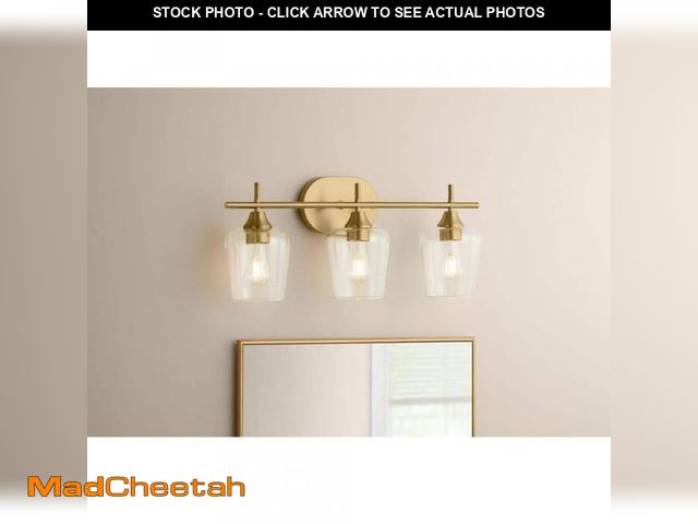 Lot 74-12491997 - Hampton Bay Pavlen 24 in. 3-Lights Antique Brass Vanity Light with Clear Glass Shades - UNUSED