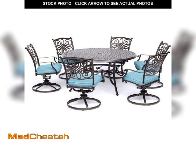 Lot 74-12202609 - Hanover Traditions 7-Piece Patio Dining Set with 60" Round Cast-Top Table and Swivel Rockers with Bl...