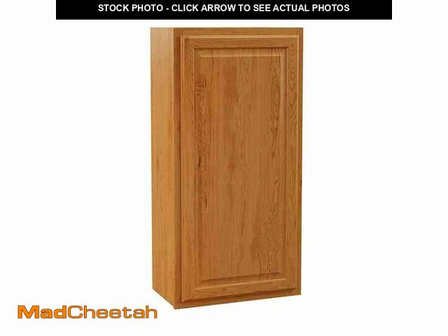 Lot 74-13098704 - Hampton Bay Hampton 21 in. W x 12 in. D x 42 in. H Assembled Wall Cabinet in Medium Oak - UNUSED