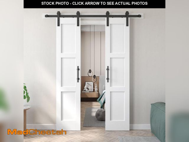 Lot 74-12488622 - Fredbeck Double 18x84 inch White Barn Door with 6.6FT Barn Door Hardware Kit Included,with MDF and W...